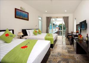 Postel nebo postele na pokoji v ubytování Lucky Leaf Hoian Villa + 37 fotografií