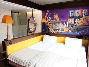 Postel nebo postele na pokoji v ubytování !FEST Hotel Rynok Square