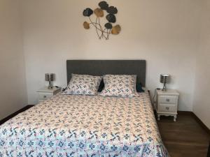 a bedroom with a large bed with two night stands at Ar vag in Ploubazlanec +25 photos