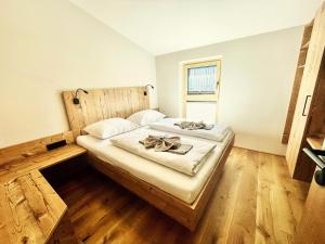 En eller flere senge i et værelse på Deluxe Apartment GRIES NINA + 27 billeder