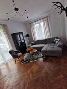 a living room with a couch and a table at Apartament Comfort Sanok in Sanok