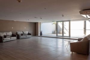 Coin salon dans l'établissement Tryp by Wyndham Asuncion