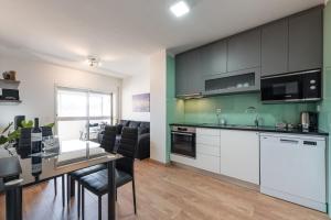 Køkken eller tekøkken på GuestReady - Never Say Never