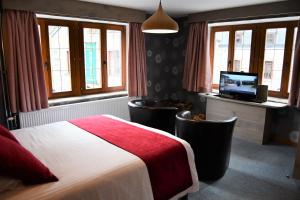 Postel nebo postele na pokoji v ubytování gite de l'hotel de la ferme
