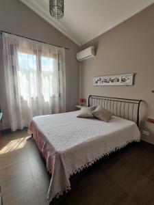Posteľ alebo postele v izbe v ubytovaní Villa Castiglione