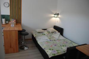 Postel nebo postele na pokoji v ubytování Apartament Legionow