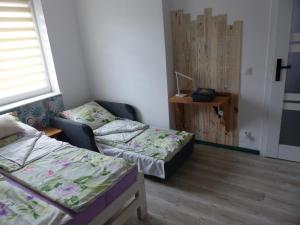 Postel nebo postele na pokoji v ubytování Apartament Legionow