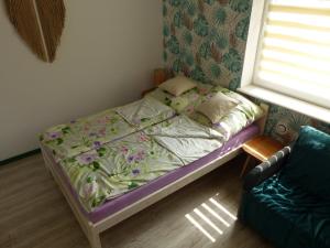 Postel nebo postele na pokoji v ubytování Apartament Legionow