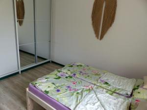 Postel nebo postele na pokoji v ubytování Apartament Legionow