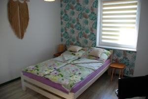 Postel nebo postele na pokoji v ubytování Apartament Legionow