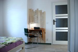 Postel nebo postele na pokoji v ubytování Apartament Legionow