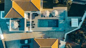 an overhead view of a house with a swimming pool at Seaview Villa Volter by "elite" in Kipseli