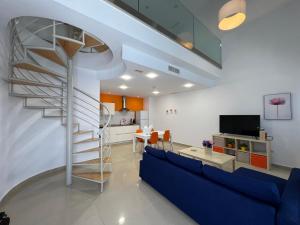 TV a/nebo společenská místnost v ubytování Ancla Real Apartamentos Loft