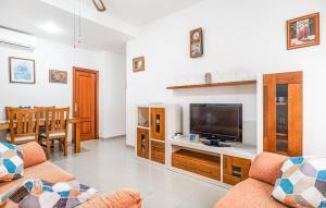 a living room with a flat screen tv at 2 Bedroom Amazing Apartment In Chipiona in Chipiona