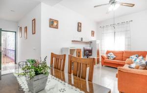 a living room with a couch and a table at 2 Bedroom Amazing Apartment In Chipiona in Chipiona