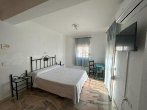 Postel nebo postele na pokoji v ubytování Hostal el Ancla + 31 fotografií