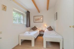 Postel nebo postele na pokoji v ubytování Hello Zeeland - Vakantiehuis Het Blauwe Hof