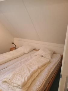 Postel nebo postele na pokoji v ubytování Hello Zeeland - Vakantiehuis Zwin 174