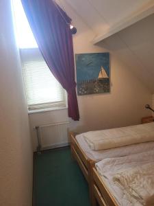 Postel nebo postele na pokoji v ubytování Hello Zeeland - Vakantiehuis Zwin 174