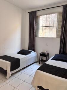 Postel nebo postele na pokoji v ubytování Hotel Loren