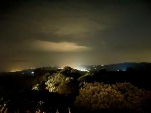 a view of a mountain at night at Casa KiSi Cottage, Rural Boutique Bed & Breakfast in Málaga