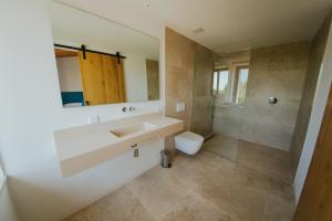 a bathroom with a sink and a toilet at Finca Son Oms in Porreres +21 photos