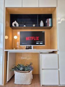 TV a/nebo společenská místnost v ubytování Lumini house
