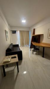 a living room with a couch and a table at MANHATTAN - JK APART Hotel in Brasilia