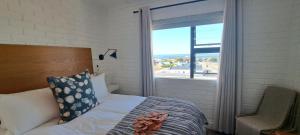 Cama o camas de una habitación en Holiday Portfolio Da Gama Bay