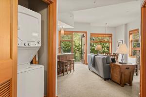 a living room with a kitchen and a dining room at Foxtail Flat Capitol Peak's Coziest Corner Unit in Snowmass Village +12 photos
