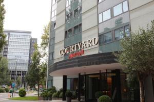 a building with a sign on the side of it at Courtyard by Marriott Düsseldorf Seestern in Düsseldorf