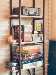 a stack of books on a book shelf at Antarctica Hostel in Ushuaia