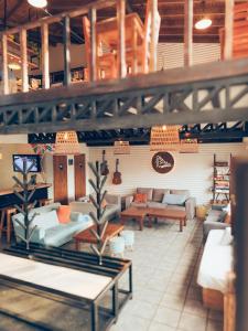 a lobby with couches and tables in a store at Antarctica Hostel in Ushuaia +45 photos