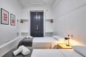 Posteľ alebo postele v izbe v ubytovaní Ella Hostel Gran Vía