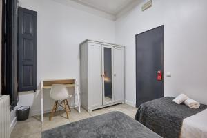 Posteľ alebo postele v izbe v ubytovaní Ella Hostel Gran Vía