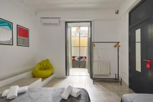 Posteľ alebo postele v izbe v ubytovaní Ella Hostel Gran Vía