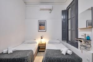 Posteľ alebo postele v izbe v ubytovaní Ella Hostel Gran Vía