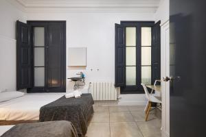 Posteľ alebo postele v izbe v ubytovaní Ella Hostel Gran Vía