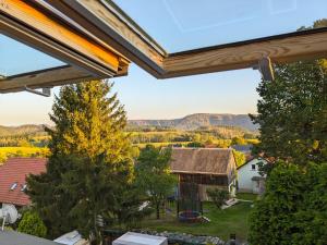 a view from the balcony of a house with a view at Urlaubsmagie - Ferienwohnung Biberburg - mit Balkon - B7 in Lichtenhain