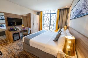 Postel nebo postele na pokoji v ubytování Anan Hotel by Snood