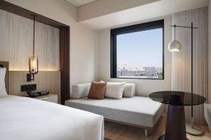 Postel nebo postele na pokoji v ubytování Courtyard by Marriott Sapporo