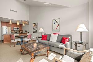 a living room with a couch and a table at Maroon Point Capitol Peak Lodge #3516 in Snowmass Village
