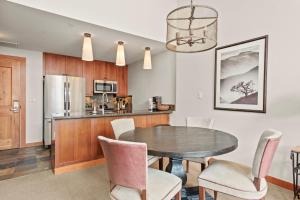 a kitchen and dining room with a table and chairs at Maroon Point Capitol Peak Lodge #3516 in Snowmass Village +17 photos