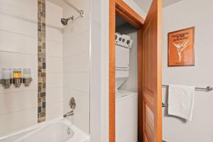 a bathroom with a bath tub and a sink at Maroon Point Capitol Peak Lodge #3516 in Snowmass Village