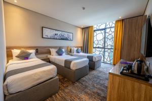 Postel nebo postele na pokoji v ubytování Anan Hotel by Snood