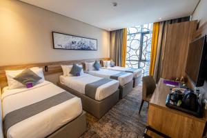 Postel nebo postele na pokoji v ubytování Anan Hotel by Snood
