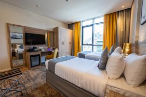 Postel nebo postele na pokoji v ubytování Anan Hotel by Snood