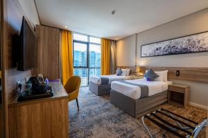 Postel nebo postele na pokoji v ubytování Anan Hotel by Snood