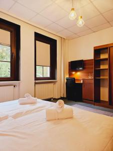 Postel nebo postele na pokoji v ubytování IKURA Hotel Self-check-in
