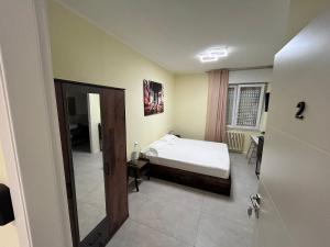 Postel nebo postele na pokoji v ubytování Urban Suite Milano